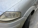 an image of a dirty car parked on the side of the road