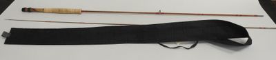 two different types of fishing rods on a table