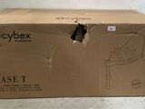 a cardboard box with a hole in it on the floor