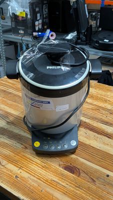 a small blender sitting on top of a wooden table