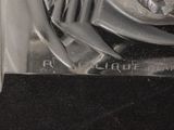 a close up of a metal object on a black surface
