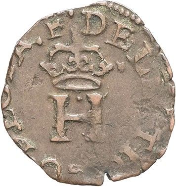 a silver coin with a crown on top of it