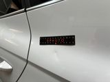 a sticker on the door of a car that says value