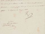 un vieux document sur lequel figure une lettre manuscrite au recto