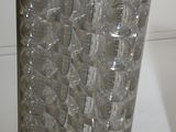 a glass vase that is sitting on a table