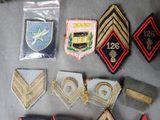 some of the badges are laid out on the table