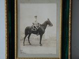 a picture of a man riding a horse in a picture frame