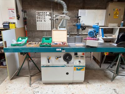 an image of a workbench in a workshop with tools on it