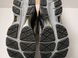 the soles of a pair of running shoes on a white surface