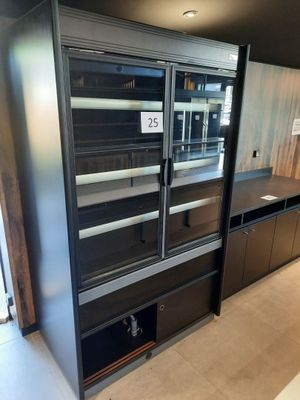 an image of a kitchen with a refrigerator and cabinets