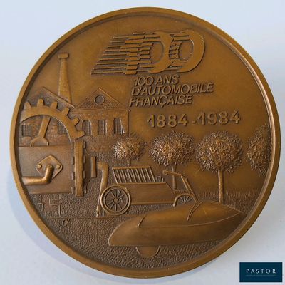 une pièce de monnaie en bronze sur laquelle est représentée une voiture