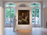 painting of a man standing in front of a painting in a room