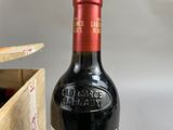 a bottle of wine that is sitting on a table