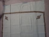 a piece of cloth with a design on it on a table