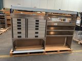 a metal cabinet with drawers and shelves in a warehouse