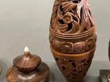 three vases that are sitting next to each other on a table