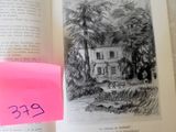 a pink post it on a book with a picture of a house on it