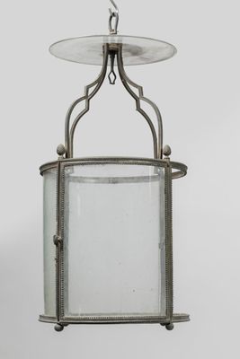 an old fashioned lantern hanging from a ceiling