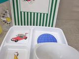 a picture of a child ' s table setting with a bowl, plate, and cup