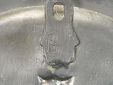a close up of a metal object with a tie on it