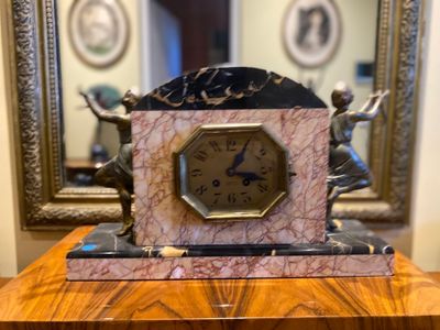 a clock that is sitting on top of a table