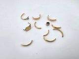four pairs of gold plated ear cuffs and a pair of silver plated ear cuffs