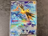 a close up of a pokemon card on a table