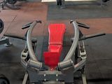 a gym with a bench, weights, and other equipment in it