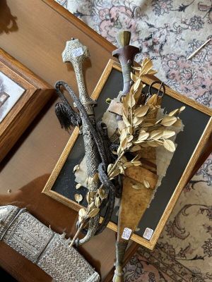 a picture of a table with a vase of flowers and a picture on it