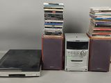 a lot of cds stacked on top of each other