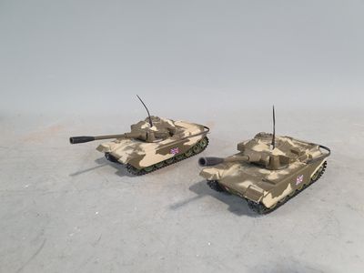 two toy tanks that are sitting on top of each other