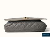 grey quilted leather clutch bag with gold clasp
