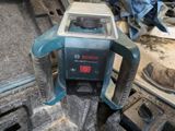 a machine that is sitting on top of a piece of wood