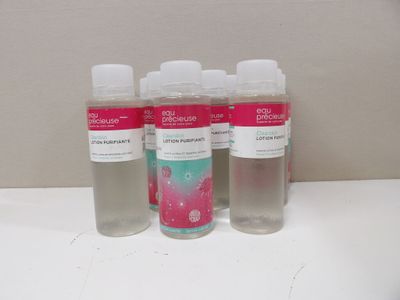 three bottles of hand sanitizer sitting on a counter top