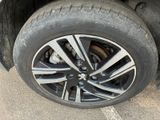 a close up of a tire on the side of a car