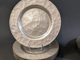 a lot of plates that are stacked on top of each other