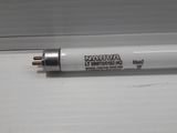 a close up of a fluorescent light bulb on a window sill