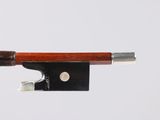 violin bow made of wood and metal on a white background