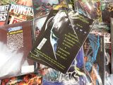 a pile of comic books on a table