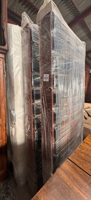 a lot of furniture that is wrapped up and ready to be shipped