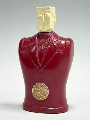 a red statue of a man in a tuxedo