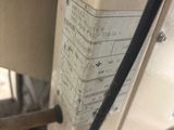 a close up of a sewing machine with a label on it