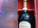 a bottle of champagne in a box on a table