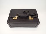 leather briefcase on white background with clippings on the handle