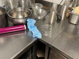many pots and pans on the counter in the kitchen