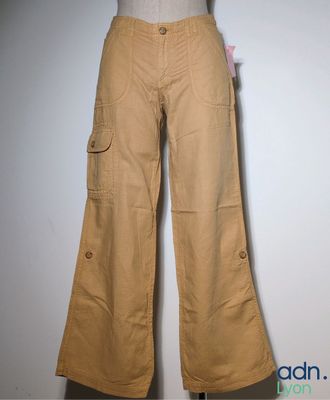 the pants are tan and have buttons on them on a mannequin dummy