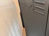 an image of a black refrigerator in a room