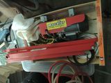 a red machine that is sitting on top of a box