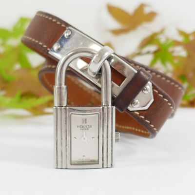a close up of a wrist watch with a padlock on it