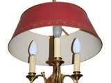 a picture of a chandelier with a red shade on it